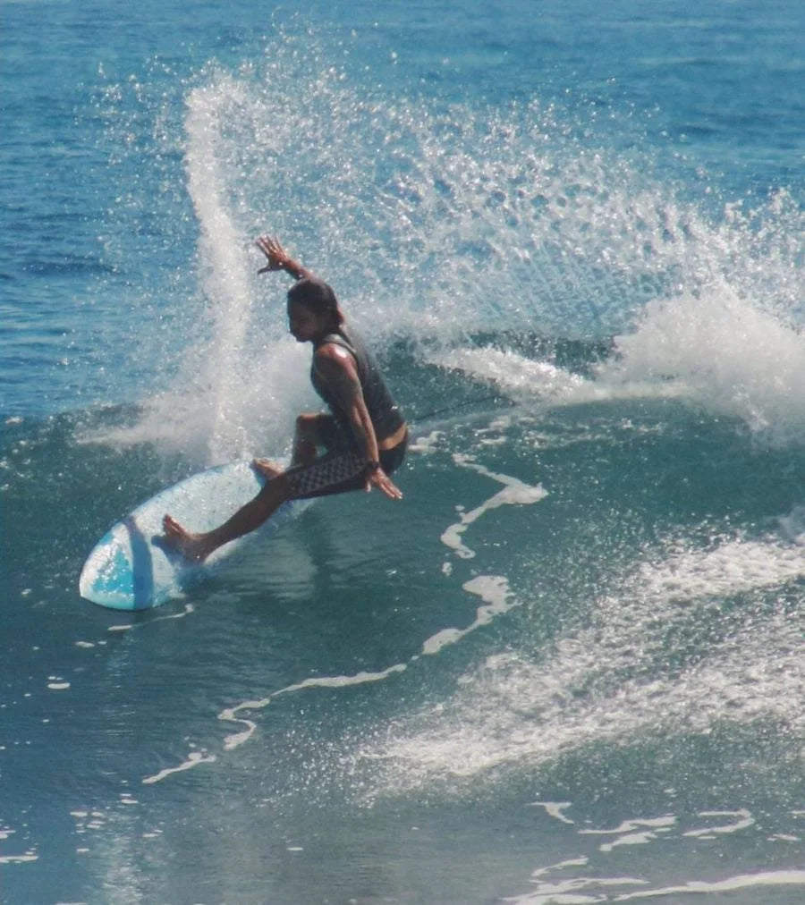 Van doing a top turn on a wave