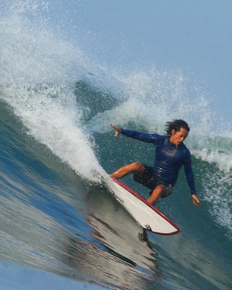 Van doing a top turn on a wave
